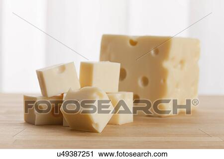 Stock Image - USA, Illinois, Metamora, Blocks of cheese on table. Fotosearch