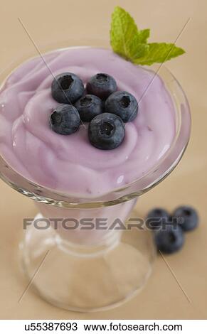 Stock Image - USA, Illinois, Metamora, Blueberry dessert in glass. Fotosearch