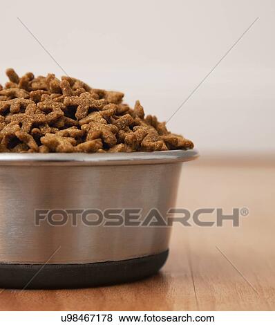 USA, Illinois, Metamora, Bowl filled with pet food View Large Photo Image Stock Photo - USA, Illinois, Metamora, Bowl filled with pet food. Fotosearch