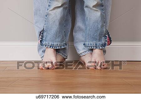 Stock Photograph - USA, Illinois, Metamora, Boy (6-7) standing on his father's feet. Fotosearch