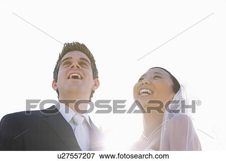 USA, Illinois, Metamora, Bride and groom laughing View Large Photo Image Stock Photo - USA, Illinois, Metamora, Bride and groom laughing. Fotosearch