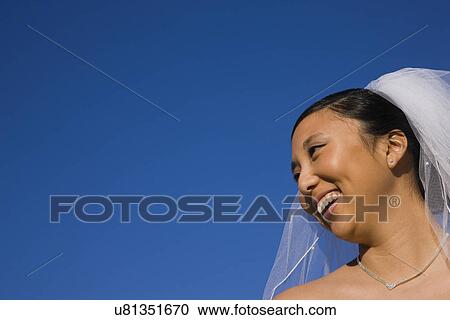 Stock Image - USA, Illinois, Metamora, Bride smiling. Fotosearch