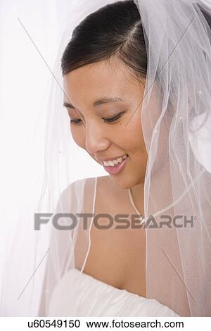 USA, Illinois, Metamora, Bride wearing veil View Large Photo Image Stock Image - USA, Illinois, Metamora, Bride wearing veil. Fotosearch