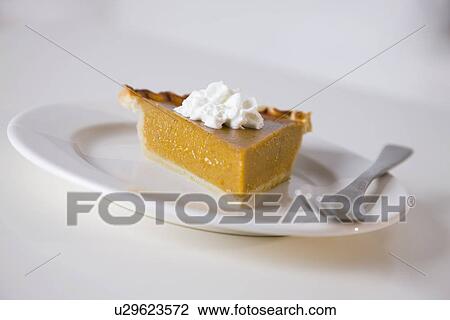 Stock Image - USA, Illinois, Metamora, Cake on plate. Fotosearch