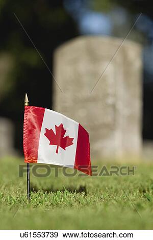 Stock Photo - USA, Illinois, Metamora, Canadian flag on cemetery. Fotosearch