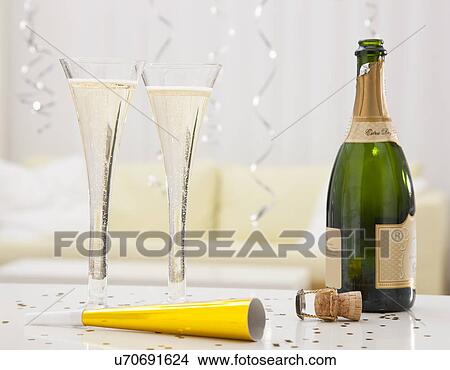 USA, Illinois, Metamora, Champagne flutes and bottle on party table View Large Photo Image Picture - USA, Illinois, Metamora, Champagne flutes and bottle on party table. Fotosearch