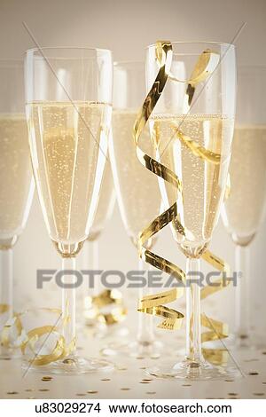 USA, Illinois, Metamora, Champagne flutes and confetti View Large Photo Image Picture - USA, Illinois, Metamora, Champagne flutes and confetti. Fotosearch