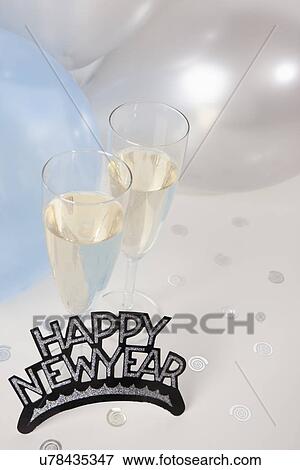 USA, Illinois, Metamora, Champagne flutes with balloons and New Year's Eve decorations View Large Photo Image Stock Photo - USA, Illinois, Metamora, Champagne flutes with balloons and New Year's Eve decorations. Fotosearch