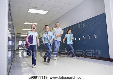 USA, Illinois, Metamora, Children (8-9, 10-11) running through school corridor View Large Photo Image Stock Photo - USA, Illinois, Metamora, Children (8-9, 10-11) running through school corridor. Fotosearch