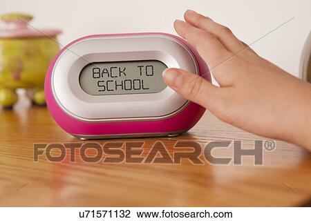 USA, Illinois, Metamora, Child's (10-11) hand pushing alarm clock View Large Photo Image Stock Image - USA, Illinois, Metamora, Child's (10-11) hand pushing alarm clock. Fotosearch