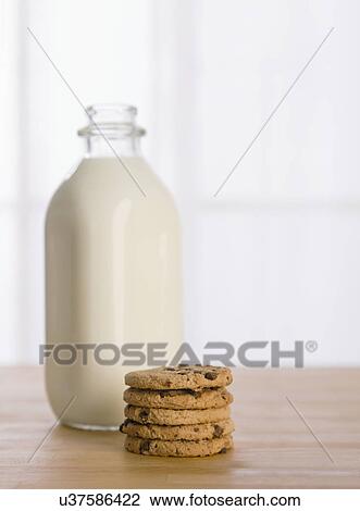 USA, Illinois, Metamora, Chocolate chip cookies beside milk bottle View Large Photo Image Stock Image - USA, Illinois, Metamora, Chocolate chip cookies beside milk bottle. Fotosearch
