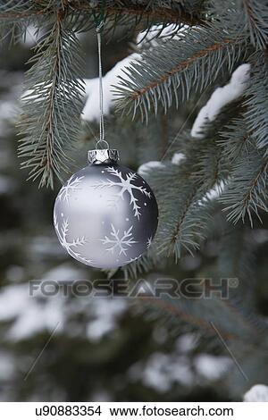 USA, Illinois, Metamora, Christmas ornament hanging from branch View Large Photo Image Picture - USA, Illinois, Metamora, Christmas ornament hanging from branch. Fotosearch
