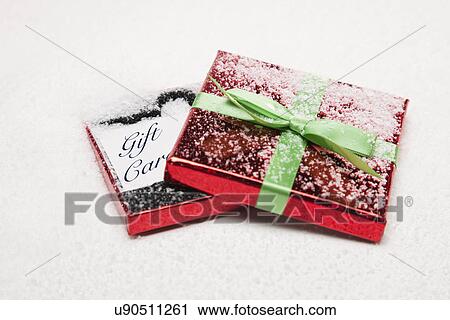USA, Illinois, Metamora, christmas present in snow View Large Photo Image Stock Image - USA, Illinois, Metamora, christmas present in snow. Fotosearch