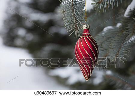 USA, Illinois, Metamora, Christmas ornament hanging from branch View Large Photo Image Stock Photo - USA, Illinois, Metamora, Christmas ornament hanging from branch. Fotosearch