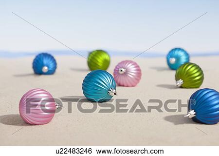 Stock Photograph - USA, Illinois, Metamora, Christmas baubles lying on desert. Fotosearch