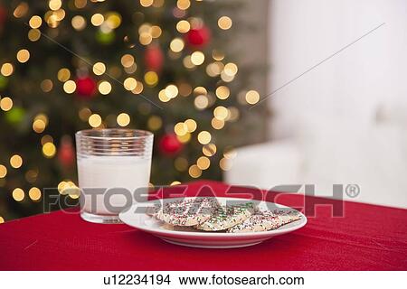 Picture - USA, Illinois, Metamora, Close up of milk and cake on Christmas table. Fotosearch