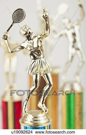 Picture - USA, Illinois, Metamora, Close up of shiny tennis trophy in shape of female player. Fotosearch