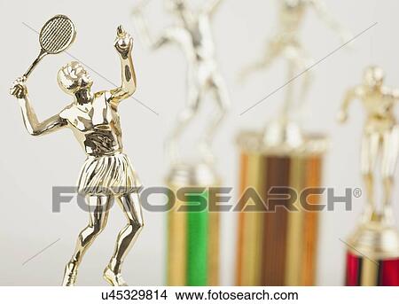 Picture - USA, Illinois, Metamora, Close up of shiny tennis trophy in shape of female player. Fotosearch