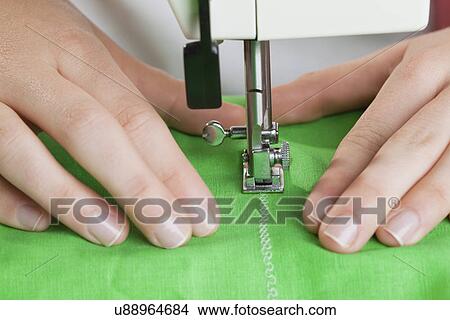 USA, Illinois, Metamora, close-up of woman sewing View Large Photo Image Picture - USA, Illinois, Metamora, close-up of woman sewing. Fotosearch