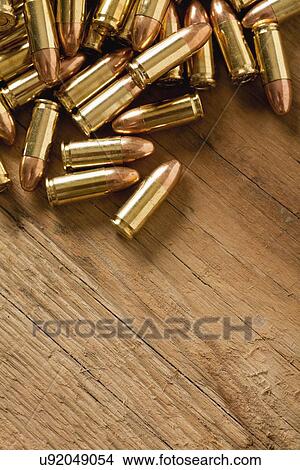 USA, Illinois, Metamora, Close-up of bullets on table View Large Photo Image Picture - USA, Illinois, Metamora, Close-up of bullets on table. Fotosearch