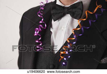 USA, Illinois, Metamora, Close-up of man wearing tuxedo at party View Large Photo Image Stock Image - USA, Illinois, Metamora, Close-up of man wearing tuxedo at party. Fotosearch