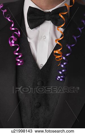USA, Illinois, Metamora, Close-up of man wearing tuxedo at party View Large Photo Image Stock Image - USA, Illinois, Metamora, Close-up of man wearing tuxedo at party. Fotosearch