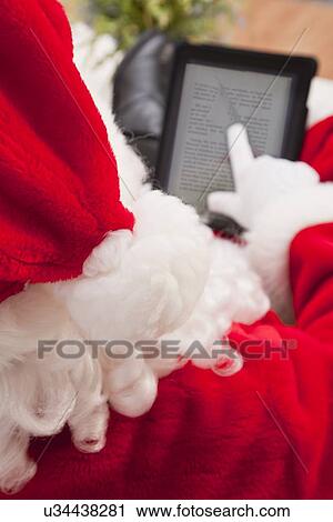 USA, Illinois, Metamora, Close-up of Santa Claus using digital tablet View Large Photo Image Stock Image - USA, Illinois, Metamora, Close-up of Santa Claus using digital tablet. Fotosearch