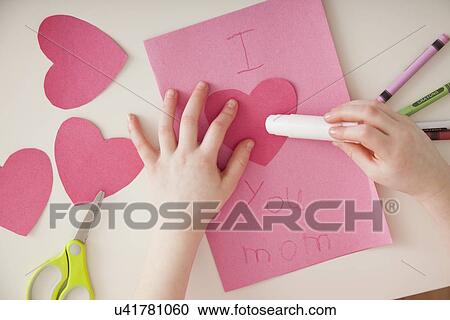 USA, Illinois, Metamora, Close up of girl's (4-5) hands preparing greeting card for Mother's Day View Large Photo Image Stock Image - USA, Illinois, Metamora, Close up of girl's (4-5) hands preparing greeting card for Mother's Day. Fotosearch