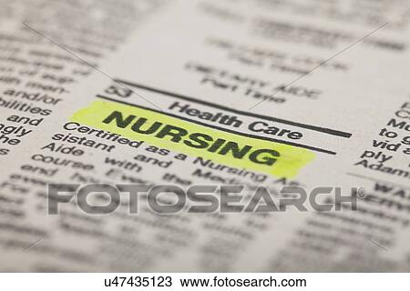 Stock Image - USA, Illinois, Metamora, Close up of job advertisement in newspaper. Fotosearch