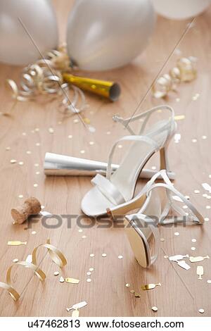 Stock Image - USA, Illinois, Metamora, close up of new year's party decorations with high heels and balloons. Fotosearch