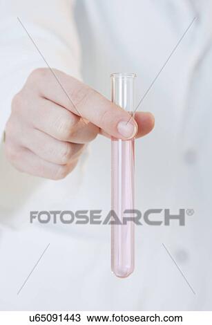 USA, Illinois, Metamora, close up of woman's hand holding laboratory vial View Large Photo Image Stock Image - USA, Illinois, Metamora, close up of woman's hand holding laboratory vial. Fotosearch