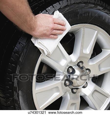 USA, Illinois, Metamora, Close-up of man's hands cleaning car's tire View Large Photo Image Stock Image - USA, Illinois, Metamora, Close-up of man's hands cleaning car's tire. Fotosearch