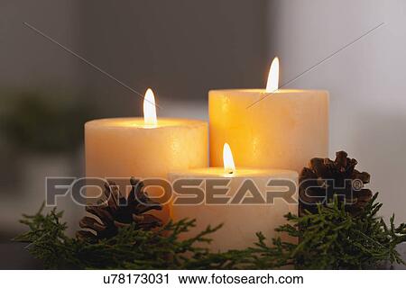 USA, Illinois, Metamora, Close up of burning candles and Christmas decorations View Large Photo Image Stock Image - USA, Illinois, Metamora, Close up of burning candles and Christmas decorations. Fotosearch