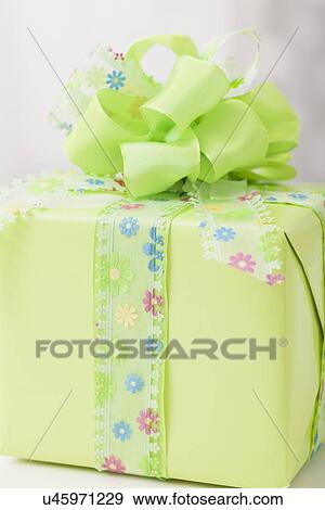 Stock Photo - USA, Illinois, Metamora, Close up of gift with ribbon bow. Fotosearch