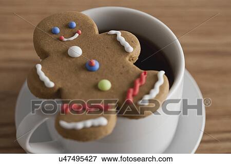 USA, Illinois, Metamora, Close up of coffee cup and gingerbread man View Large Photo Image Stock Photo - USA, Illinois, Metamora, Close up of coffee cup and gingerbread man. Fotosearch