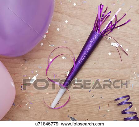 Stock Photo - USA, Illinois, Metamora, close up of new year's eve party horn blower. Fotosearch