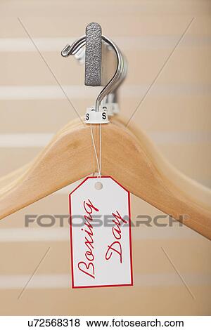 USA, Illinois, Metamora, Close-up of Boxing Day tag on empty hanger in shop View Large Photo Image Stock Photo - USA, Illinois, Metamora, Close-up of Boxing Day tag on empty hanger in shop. Fotosearch