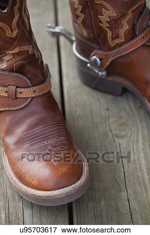 USA, Illinois, Metamora, Close-up of cowboy boots with spurs View Large Photo Image Stock Photo - USA, Illinois, Metamora, Close-up of cowboy boots with spurs. Fotosearch