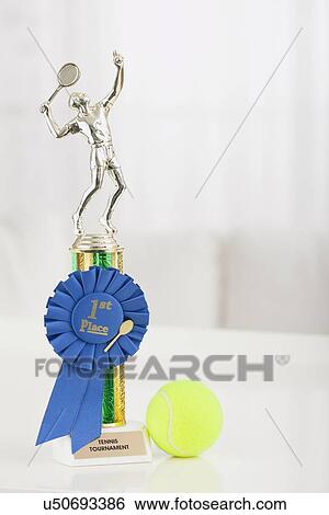 Stock Photograph - USA, Illinois, Metamora, Close up of shiny tennis trophy in shape of male player. Fotosearch