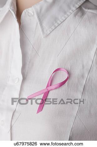 Stock Photograph - USA, Illinois, Metamora, close up of woman wearing pink ribbon. Fotosearch