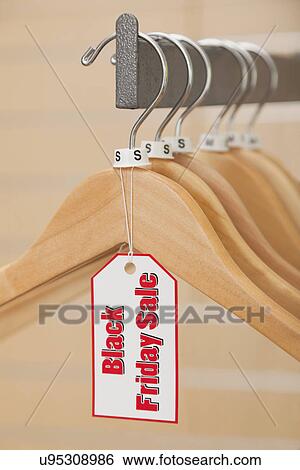 USA, Illinois, Metamora, Close-up of Boxing Day tag on empty hanger in shop View Large Photo Image Stock Photograph - USA, Illinois, Metamora, Close-up of Boxing Day tag on empty hanger in shop. Fotosearch