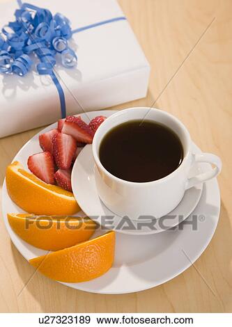USA, Illinois, Metamora, Coffee with fruits and gift wrapped in paper View Large Photo Image Stock Photo - USA, Illinois, Metamora, Coffee with fruits and gift wrapped in paper. Fotosearch