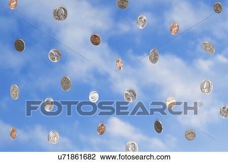 Stock Image - USA, Illinois, Metamora, Coins falling from sky. Fotosearch