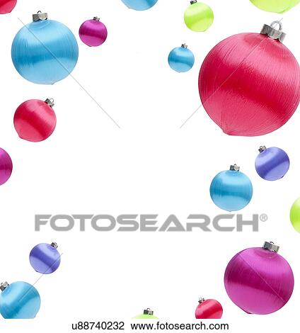 Stock Image - USA, Illinois, Metamora, Colorful Christmas ornaments against white background. Fotosearch