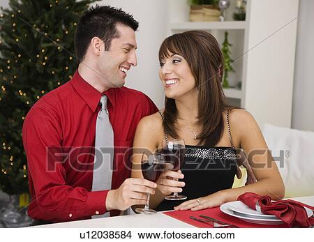 USA, Illinois, Metamora, Couple drinking wine in room View Large Photo Image Picture - USA, Illinois, Metamora, Couple drinking wine in room. Fotosearch