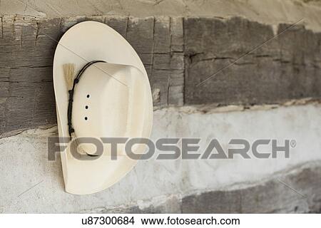 USA, Illinois, Metamora, Cowboy hat hanging outdoors View Large Photo Image Picture - USA, Illinois, Metamora, Cowboy hat hanging outdoors. Fotosearch