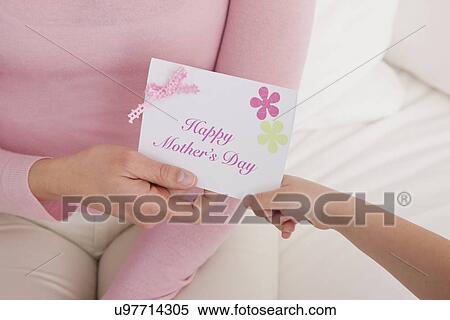 USA, Illinois, Metamora, daughter (4-5) giving greeting card to mother, close-up of hands View Large Photo Image Stock Photography - USA, Illinois, Metamora, daughter (4-5) giving greeting card to mother, close-up of hands. Fotosearch