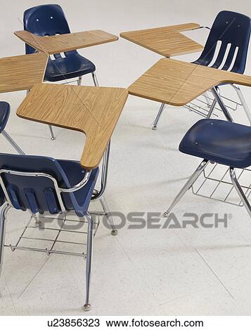 Stock Image - USA, Illinois, Metamora, Desks and chairs in classroom. Fotosearch