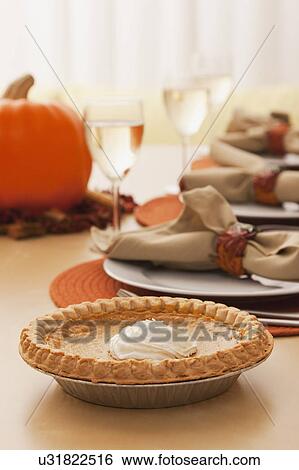 USA, Illinois, Metamora, Dining table with pumpkin pie View Large Photo Image Stock Photograph - USA, Illinois, Metamora, Dining table with pumpkin pie. Fotosearch