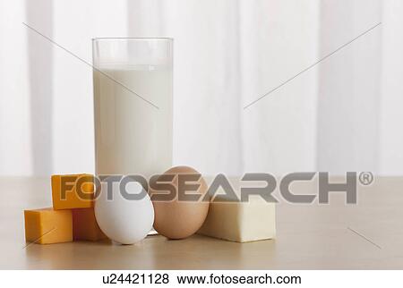 Stock Photo - USA, Illinois, Metamora, Eggs and cheese beside glass of milk. Fotosearch